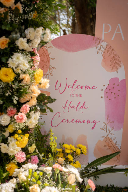 Signage and Floral detail — Haldi decor — Taj Exotica